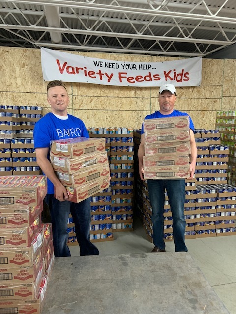 Ryan and John holding boxes under Variety